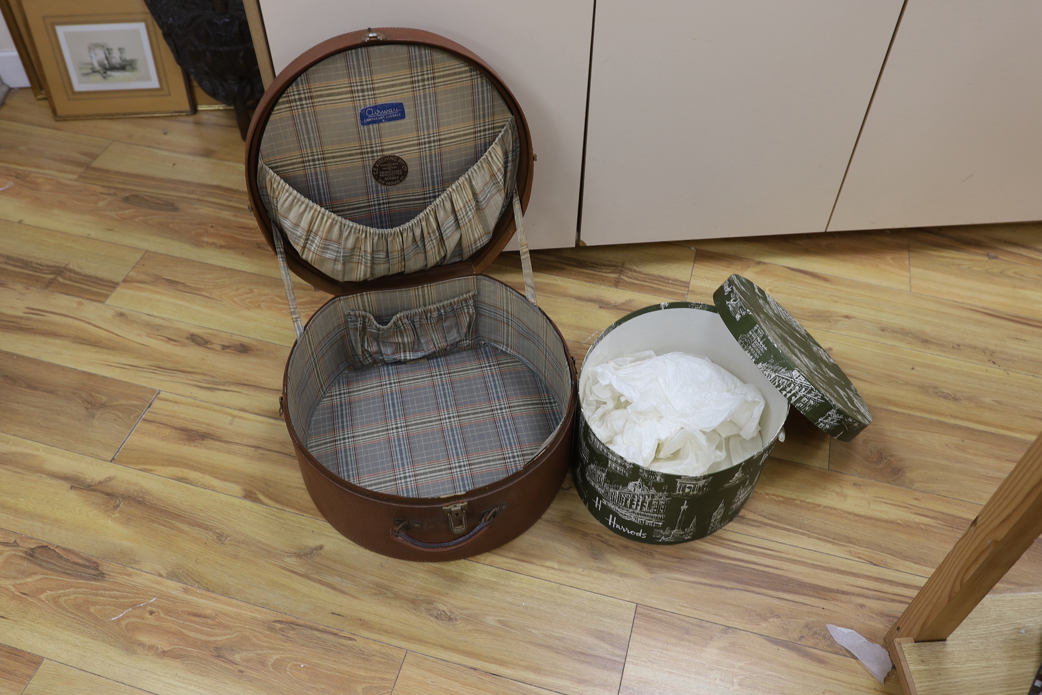 A circular Harrods branded hat box and a larger gents brown leather hat box, Harrods box 36cm diameter